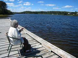 Long Term Care resident on a dock by a lake