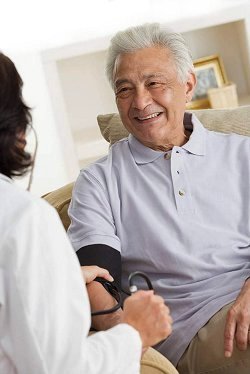 Assisted Living Program resident being visited by care giver