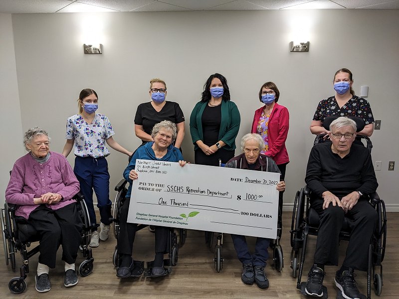 Northern Credit Union members holding giant donation cheque