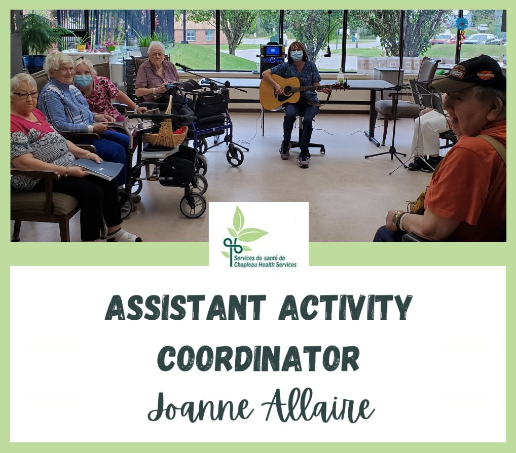 Joanne Allaire playing guitar for a group of residents