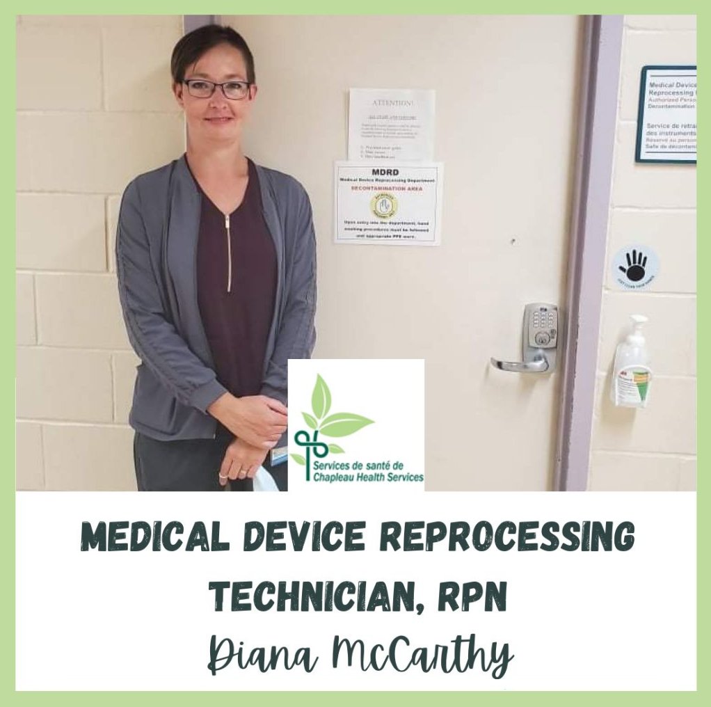 Technician Diana McCarthy standing by a door