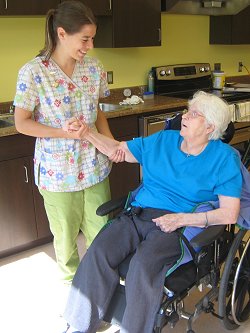 Volunteer visiting with patient