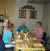 Seniors eating dinner in dining room