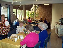 Seniors eating dinner in dining room