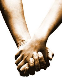 Two people holding hands
